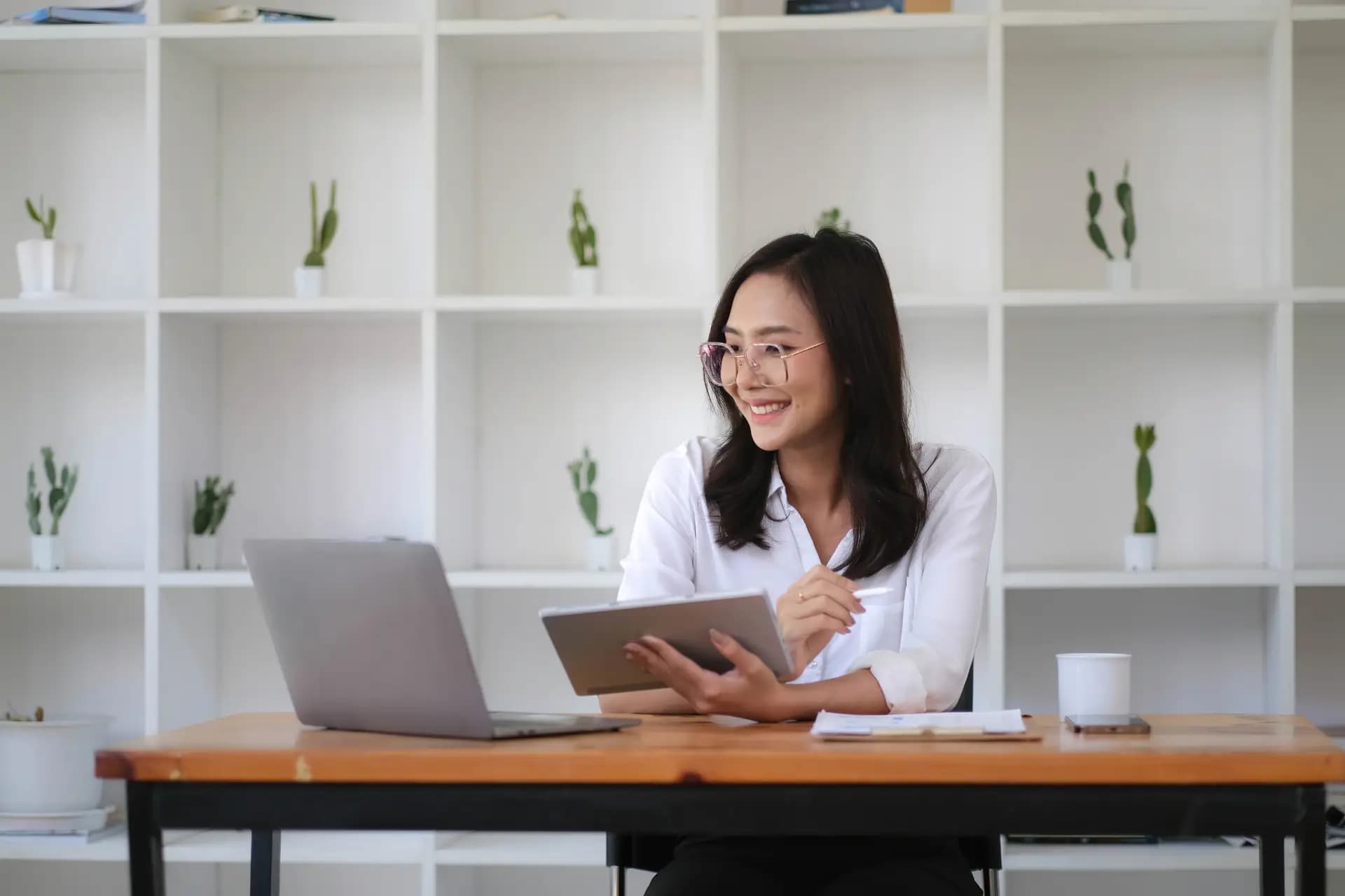 Agency team member using a laptop while coordinating work