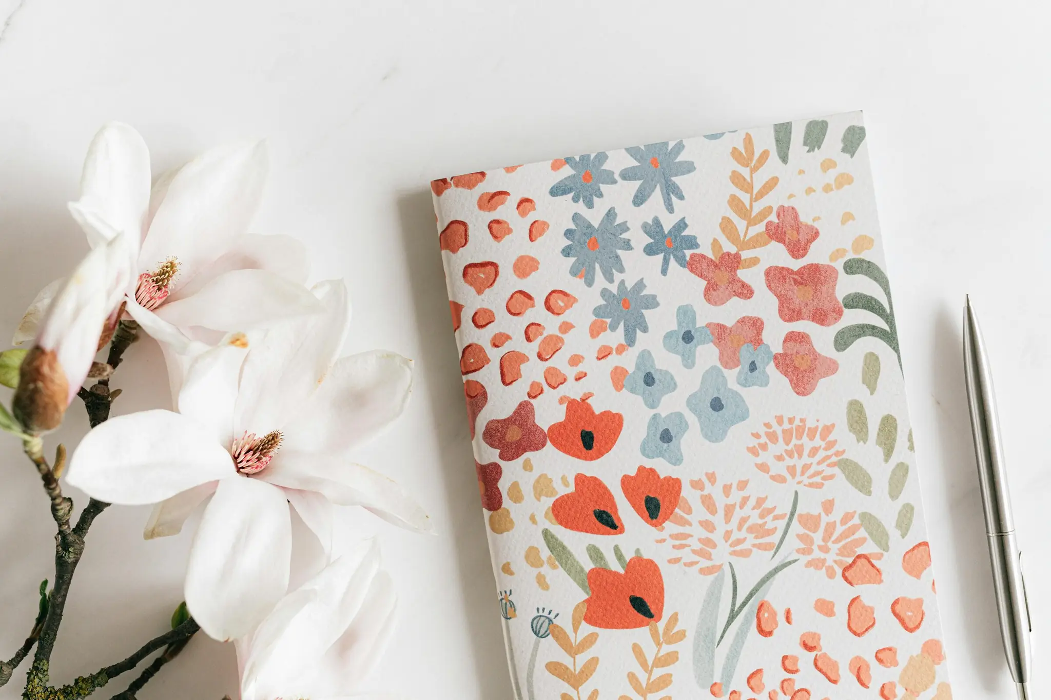 Flower with notebook and pen